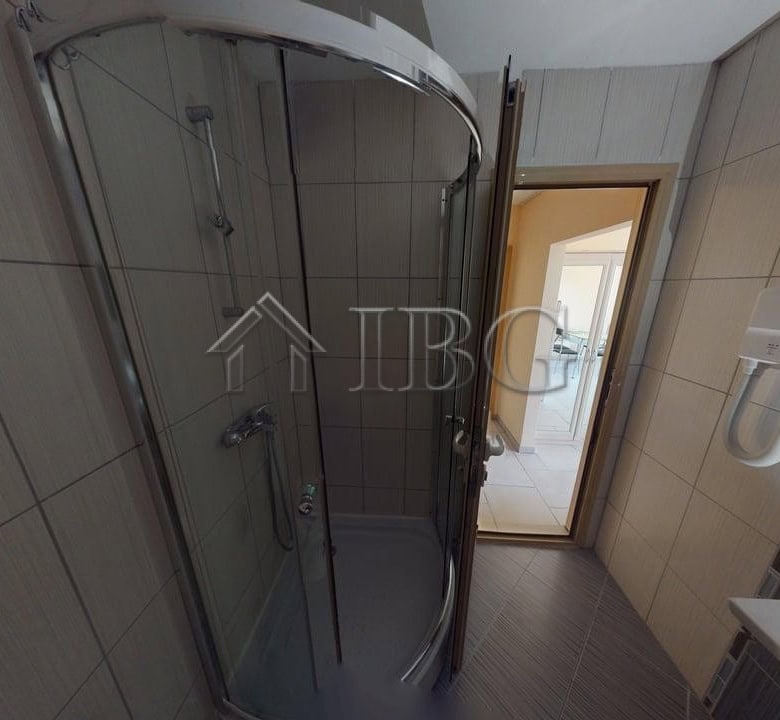 Bright bathroom with shower cabin in Avalon Complex, Sunny Beach.