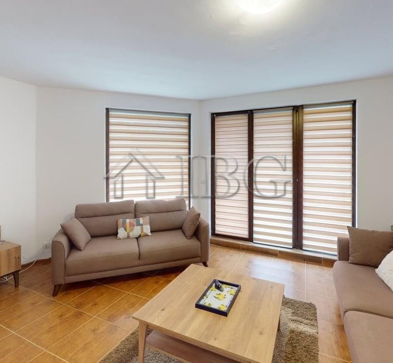 Bright and spacious living area with large windows and comfortable sofas in Bay View Villas, Koshari.
