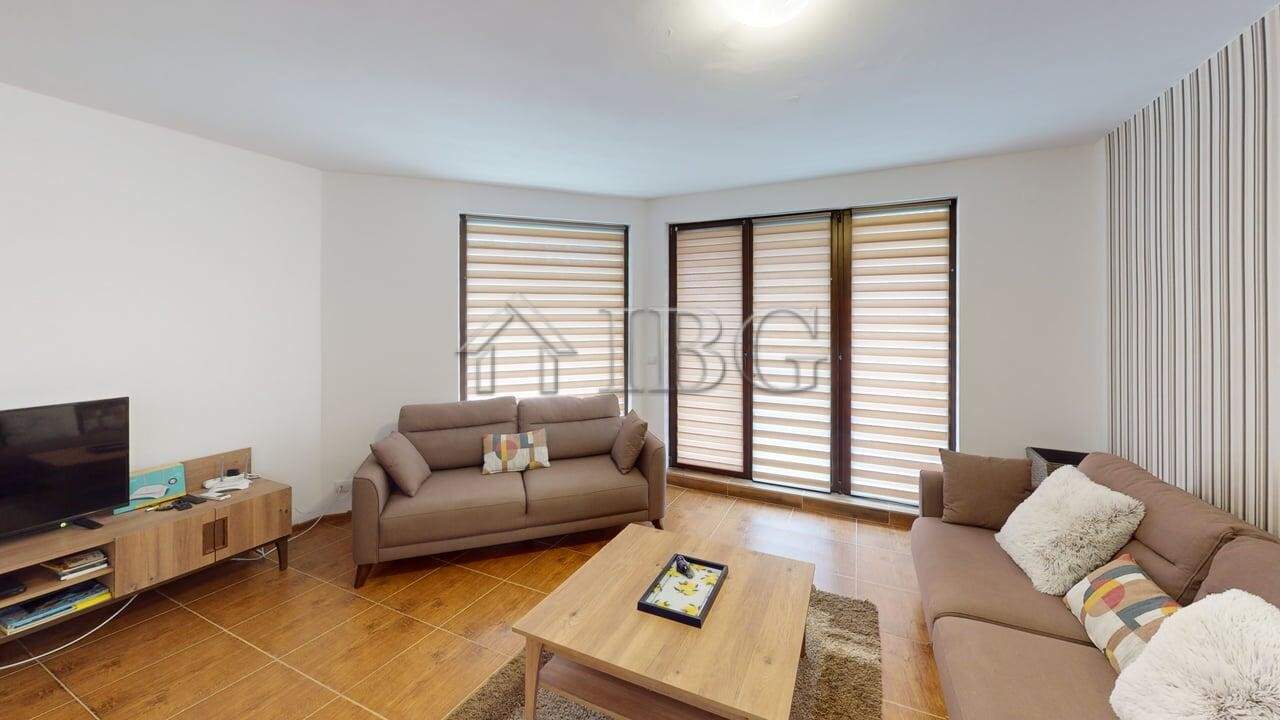 Bright and spacious living area with large windows and comfortable sofas in Bay View Villas, Koshari.
