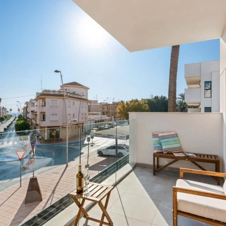 Bright 2-bedroom apartment with balcony views in Santiago De La Ribera, Murcia, Spain. Perfect for s.