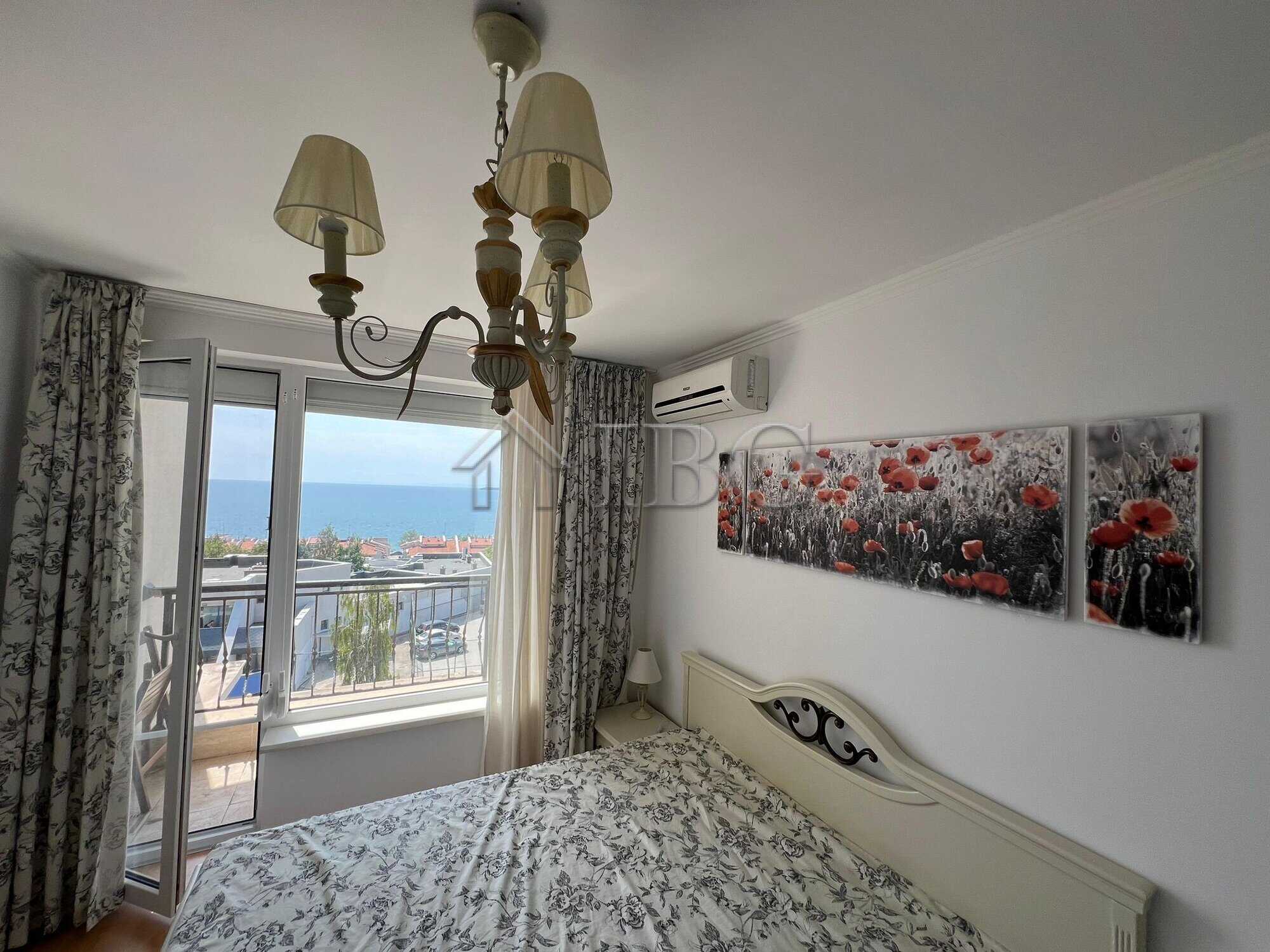 Sea view bedroom with balcony in Sveti Vlas apartment.