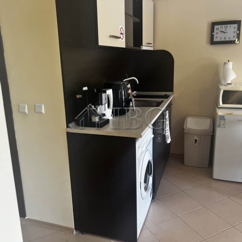 Bright, functional kitchen area with appliances and a cozy dining space.