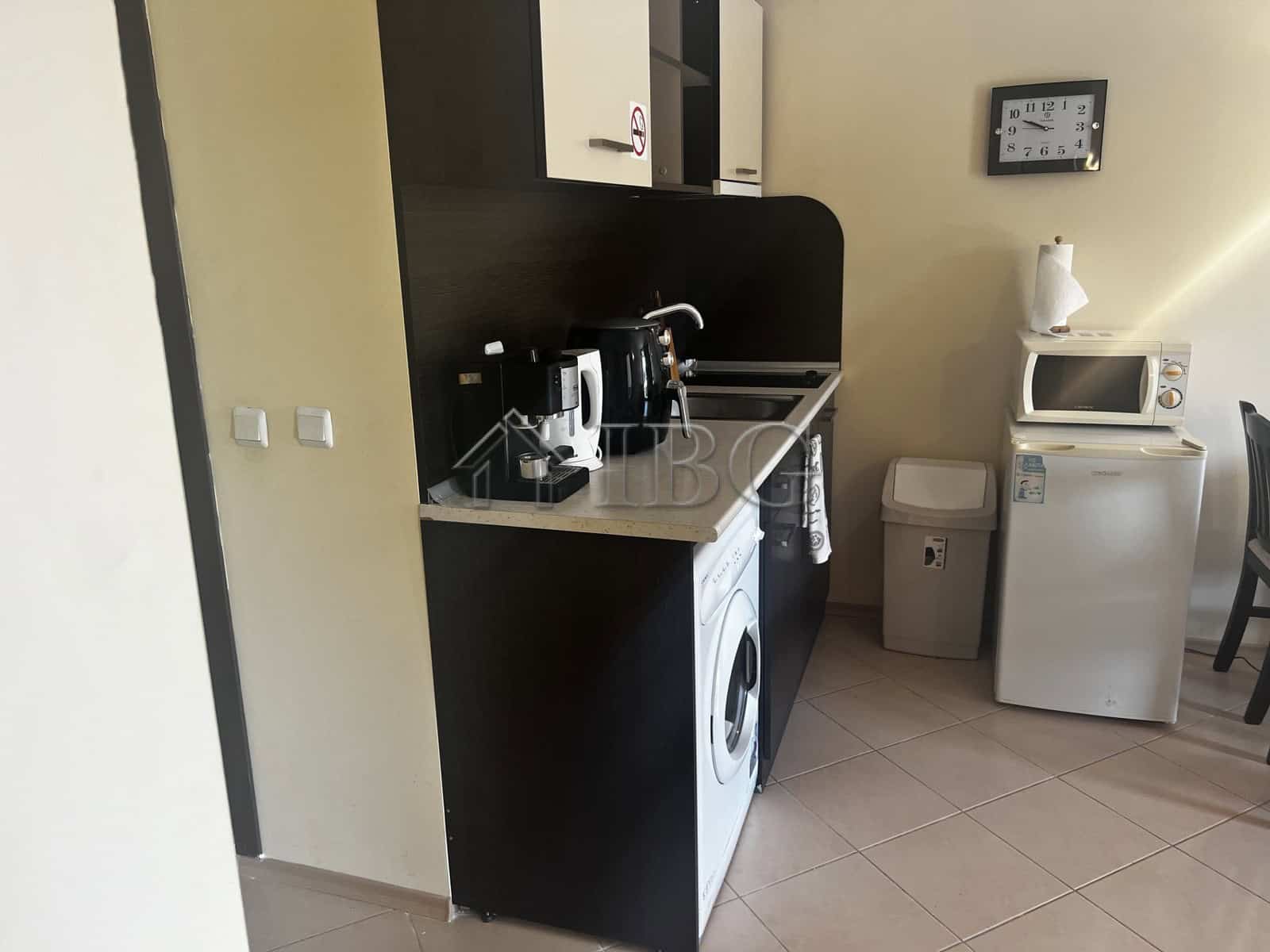 Bright, functional kitchen area with appliances and a cozy dining space.