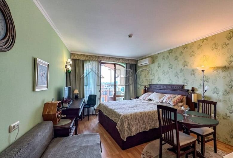 Beachfront studio apartment with sea views at Grand Hotel Sveti Vlas. Modern interior, cozy bedroom,.