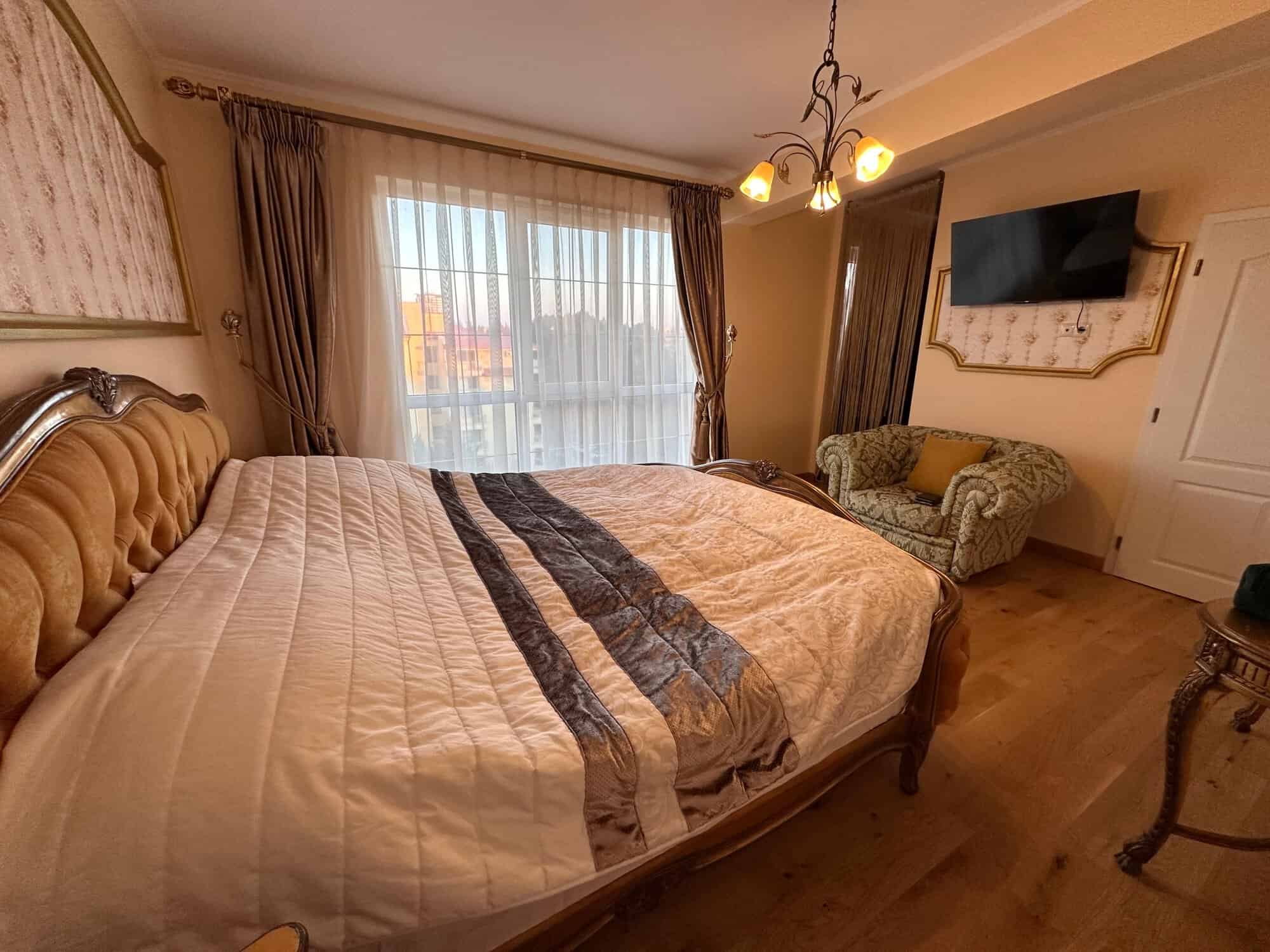 Interior view of a spacious 2-bedroom apartment in Venera Palace, Sunny Beach, with a large bed and.
