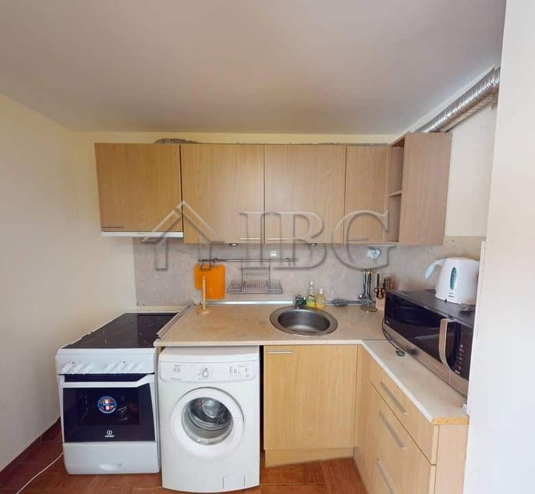 Bright 2-bedroom apartment in Sunny Fort complex, Sunny Beach, with modern kitchen and essential app.