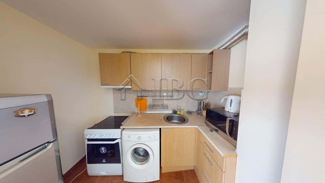 Bright 2-bedroom apartment in Sunny Fort complex, Sunny Beach, with modern kitchen and essential app.