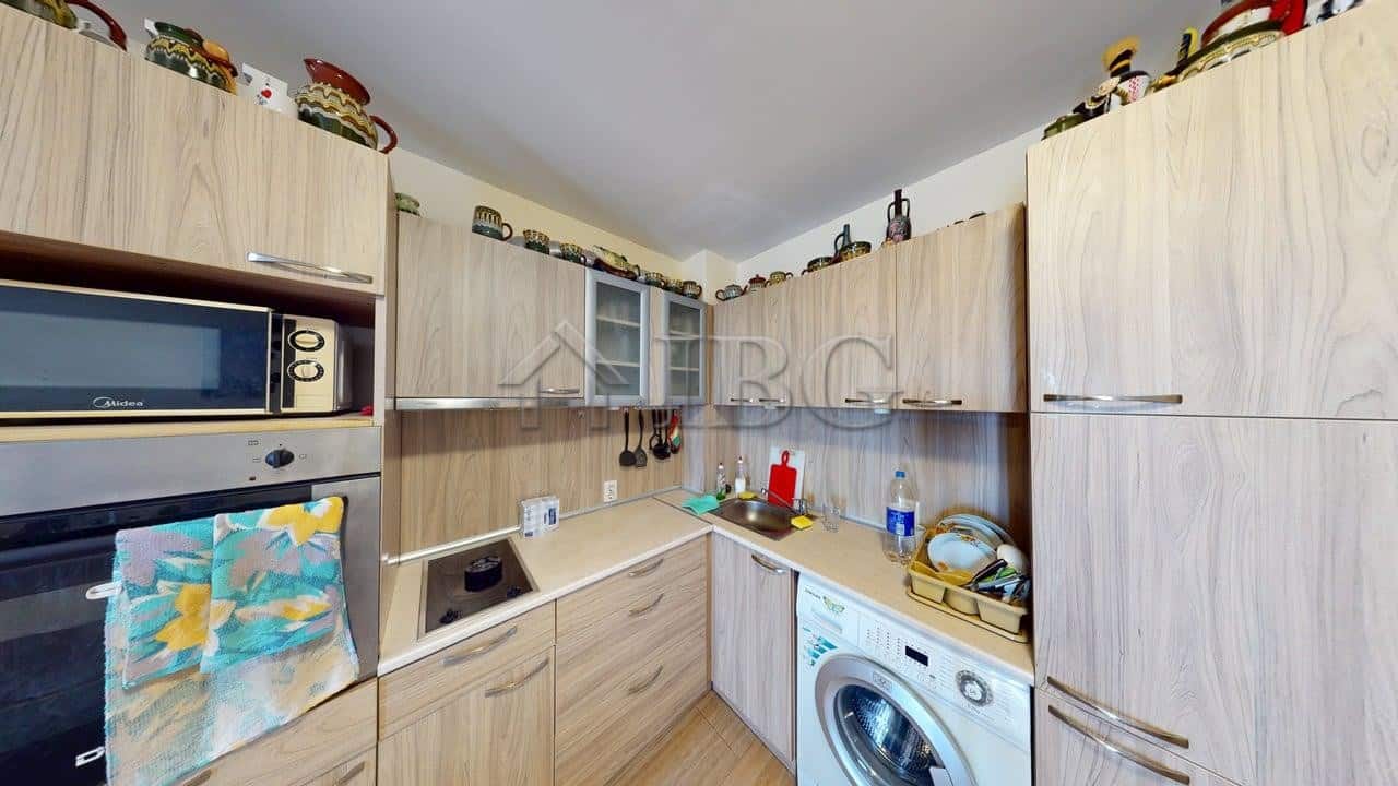 Bright kitchen with modern appliances in Kosharitsa property.