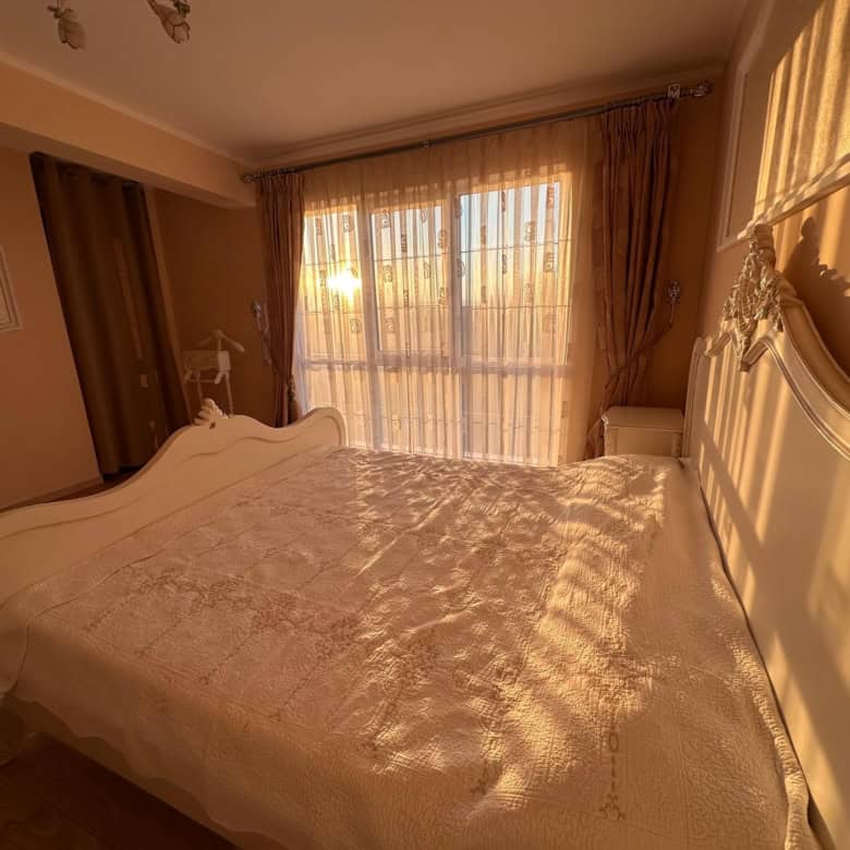 Bright, airy 2-bedroom apartment in Venera Palace with large windows and elegant decor.