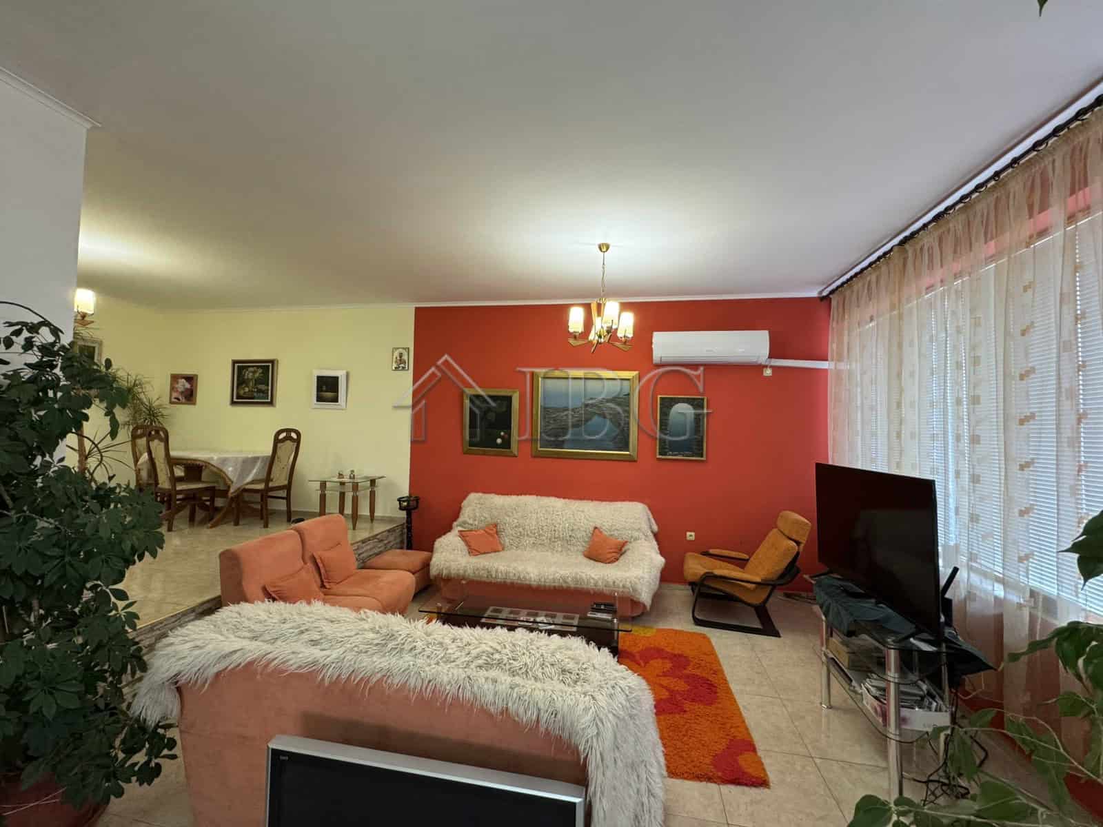 Bright living room with modern decor and large windows in Kosharitsa.