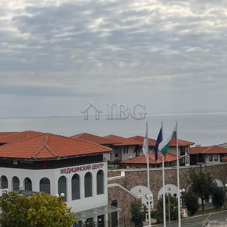 Sea view apartment in Sveti Vlas with pool and cityscape.