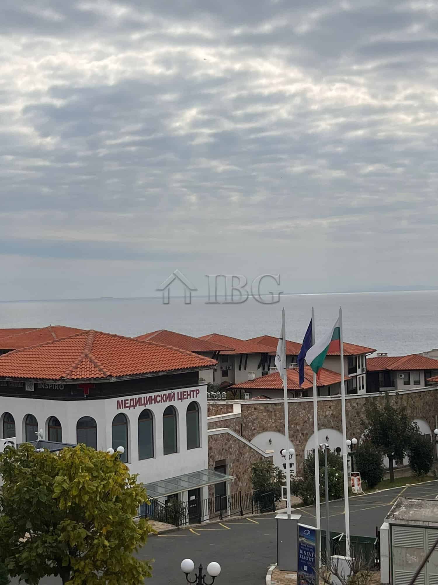Sea view apartment in Sveti Vlas with pool and cityscape.