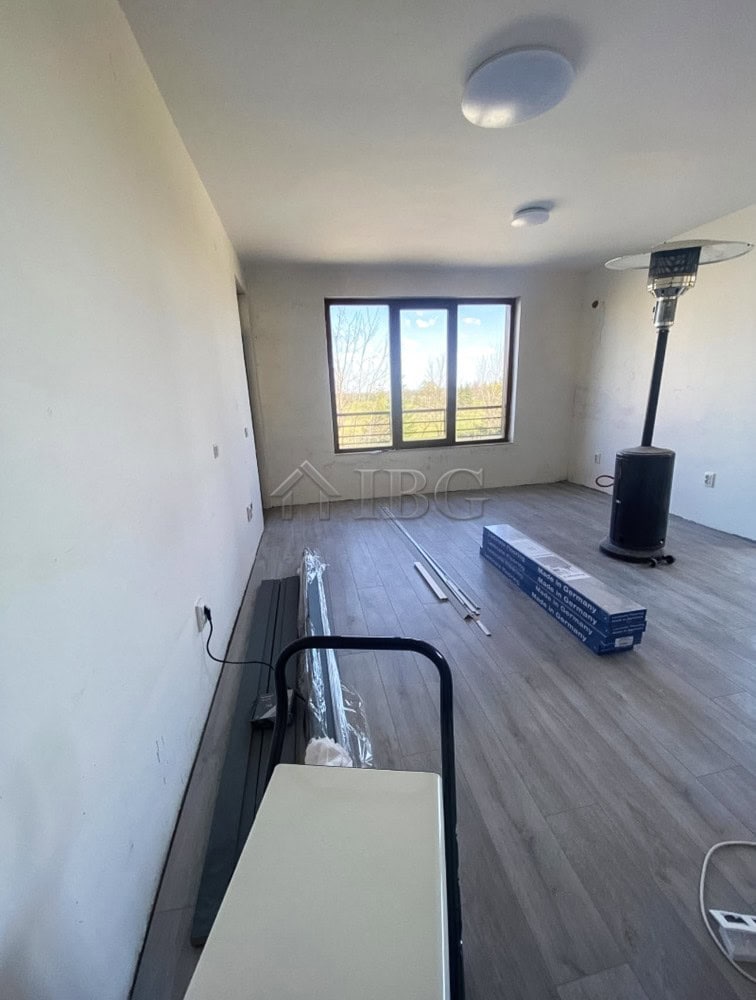 Bright 1-bedroom apartment with spacious living area, large window, and scenic views in Lighthouse G.