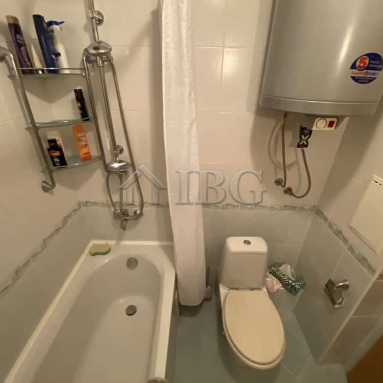 Apartment bathroom with bathtub, toilet, and water heater in Vineyards Resort, Aheloy.
