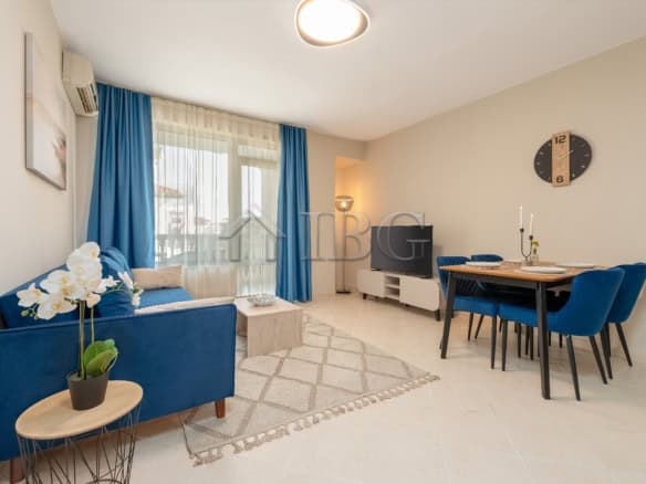 Bright 2-bedroom apartment with pool view, stylish decor, and spacious living area in Sunny Beach.