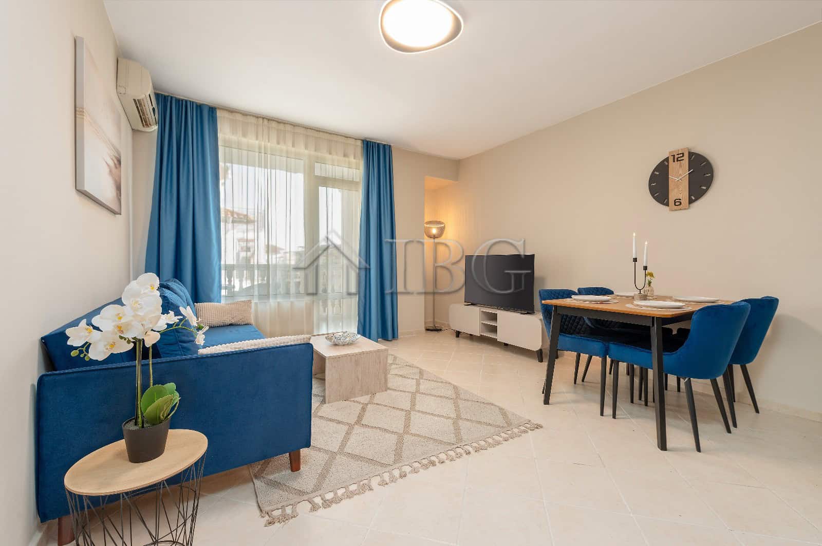 Bright 2-bedroom apartment with pool view, stylish decor, and spacious living area in Sunny Beach.