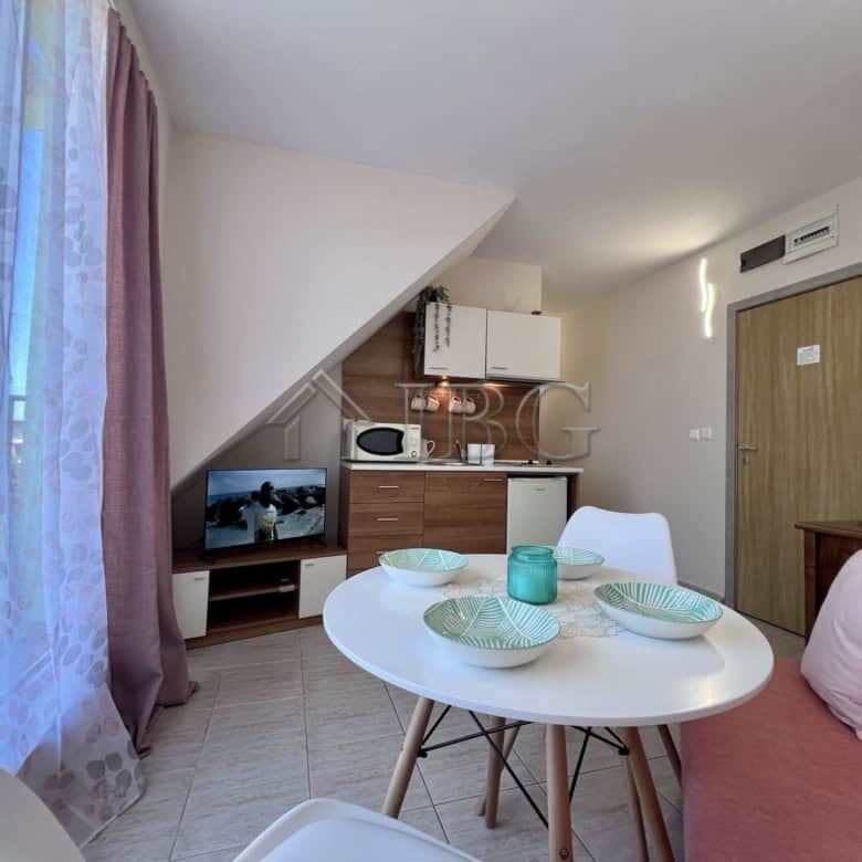 Bright apartment with pool view in Dolce Vita 2, Sveti Vlas, featuring a compact kitchen and dining.