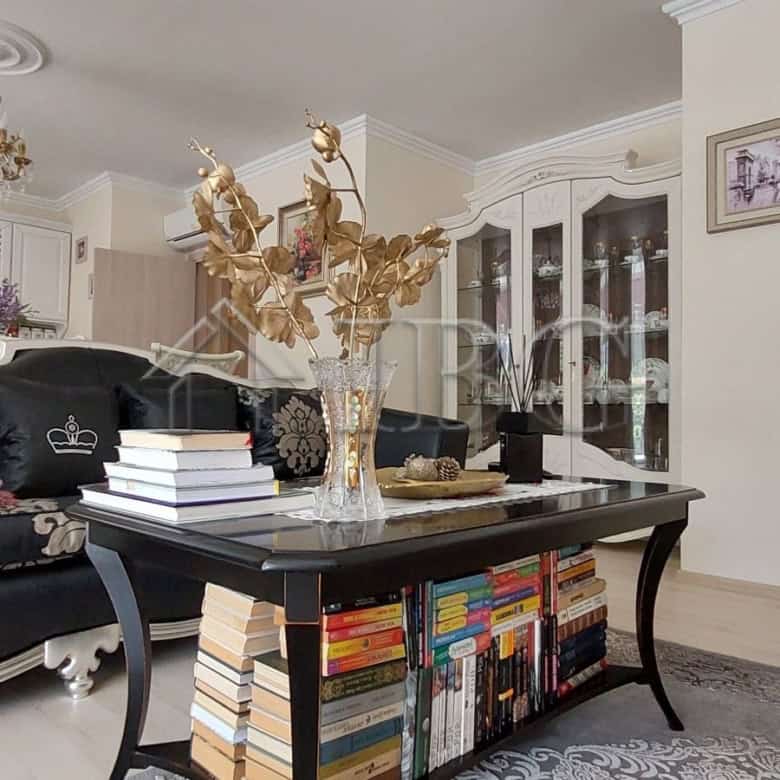 Elegant living room with modern furniture and decorative accents in a luxury townhouse.