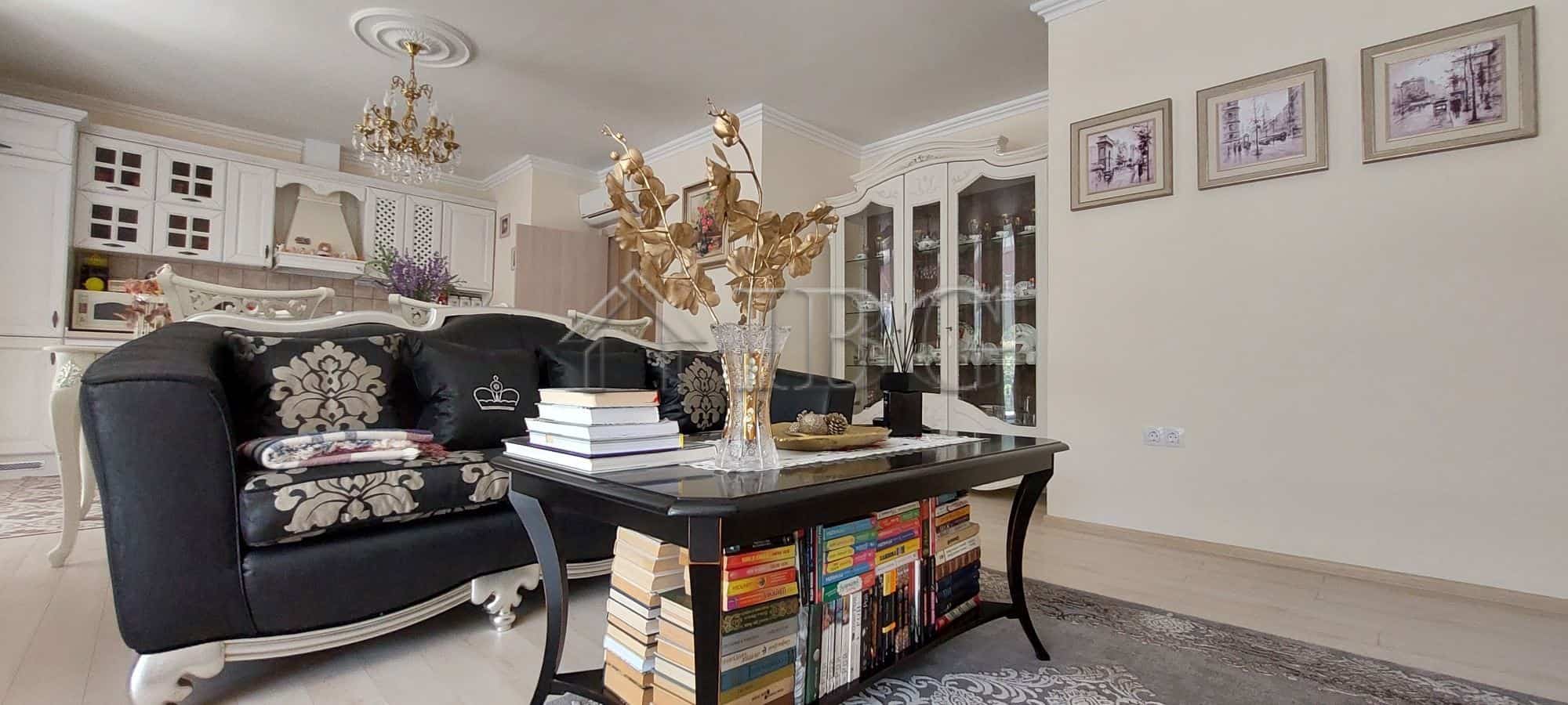 Elegant living room with modern furniture and decorative accents in a luxury townhouse.