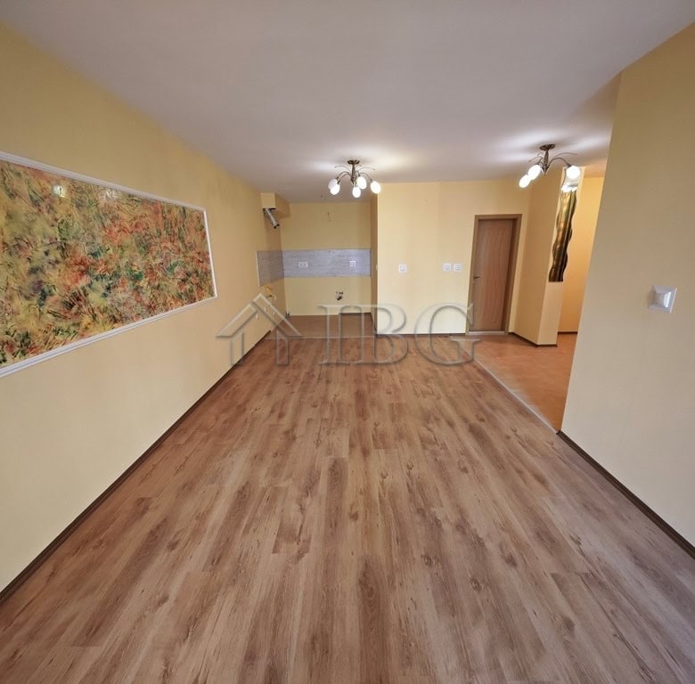 Spacious interior of a one-bedroom apartment with pool view in Parus Complex, Pomorie, Bulgaria.