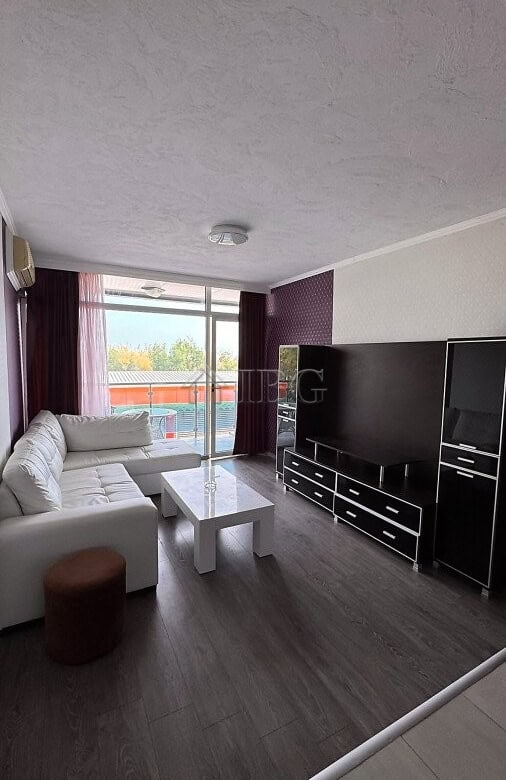 Apartment with living room, sofa, and TV in Gallery 2 complex, Sunny Beach.