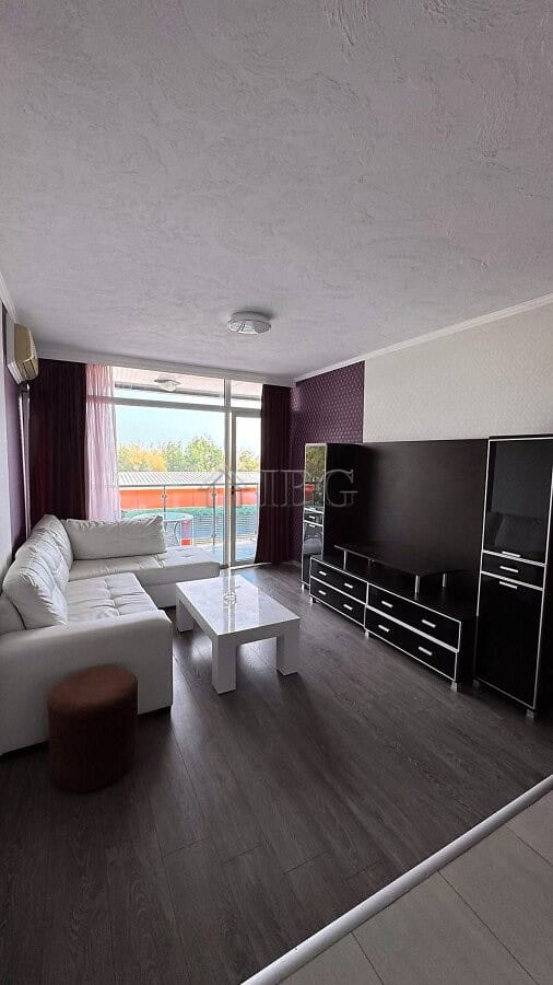 Apartment with living room, sofa, and TV in Gallery 2 complex, Sunny Beach.