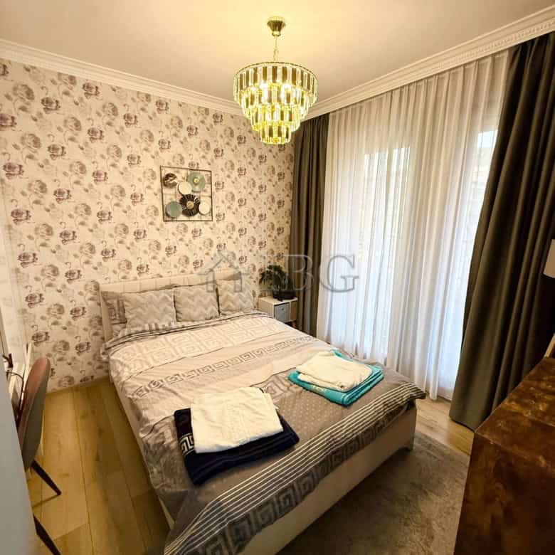 Elegant bedroom in Porto Paradiso complex, Sveti Vlas with modern decor and natural light.