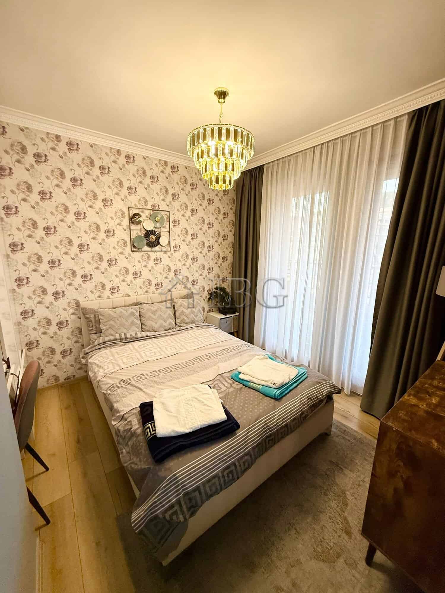 Elegant bedroom in Porto Paradiso complex, Sveti Vlas with modern decor and natural light.