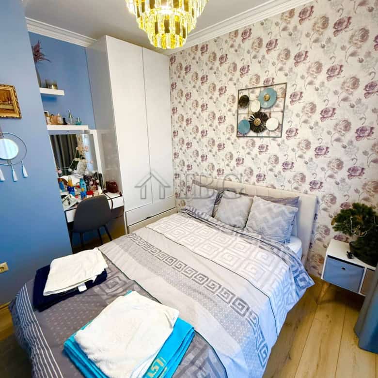 Luxury bedroom with floral wallpaper and elegant decor in Sveti Vlas.