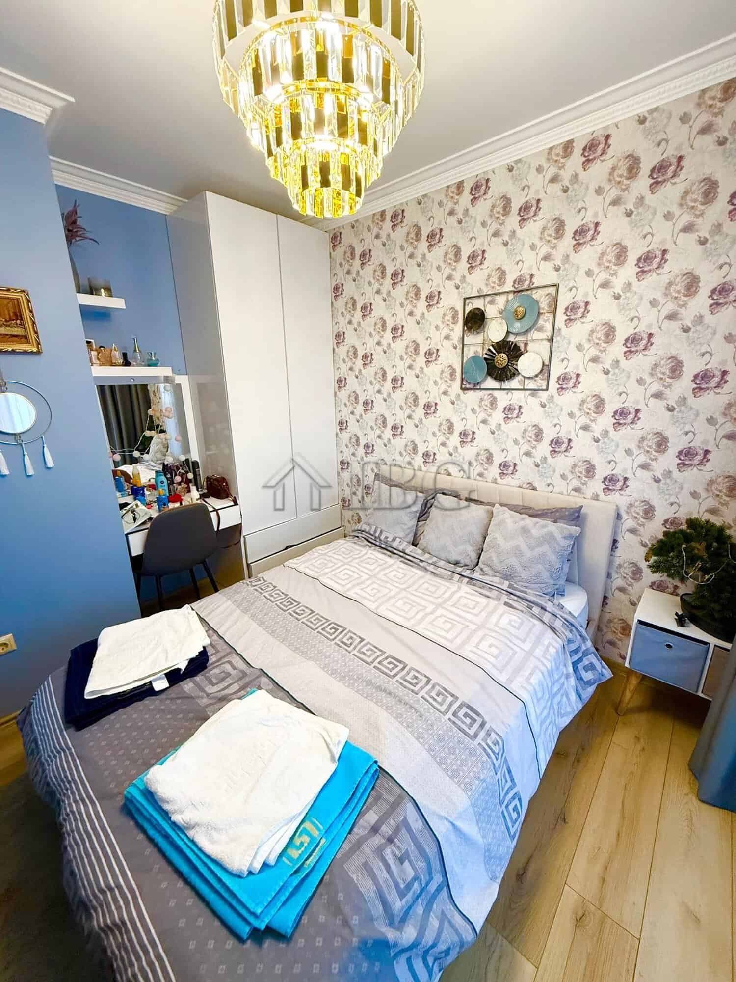 Luxury bedroom with floral wallpaper and elegant decor in Sveti Vlas.