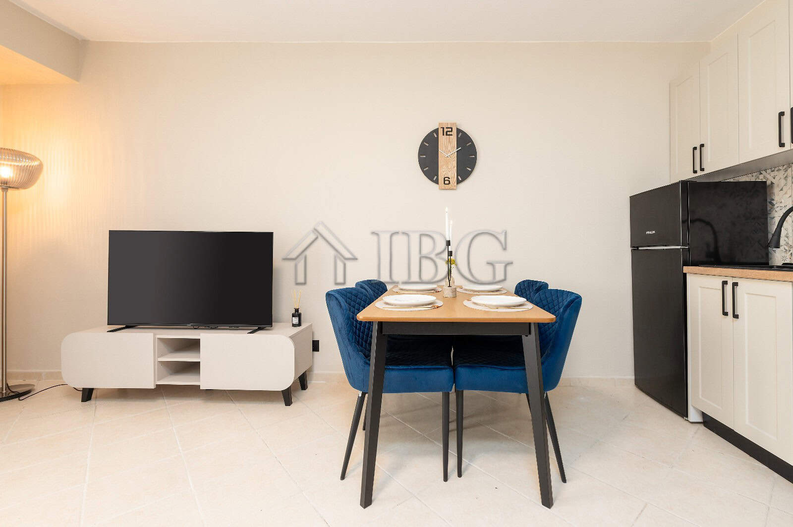 Bright interior of a renovated 2-bedroom apartment with modern furnishings and a view of the pool.