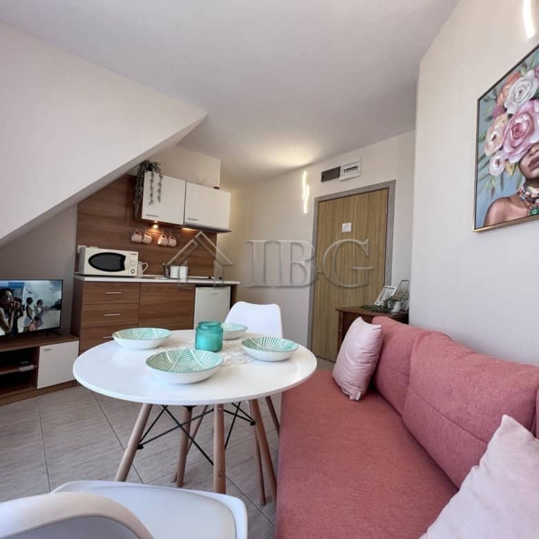 Apartment with pool view in Sveti Vlas, Bulgaria, featuring a modern interior and compact living spa.