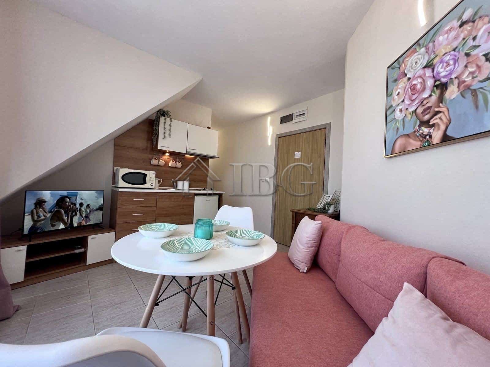 Apartment with pool view in Sveti Vlas, Bulgaria, featuring a modern interior and compact living spa.
