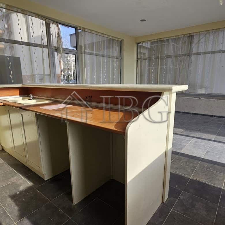 Bright commercial space with large windows in Sunny Beach. Ideal location for retail or office use.