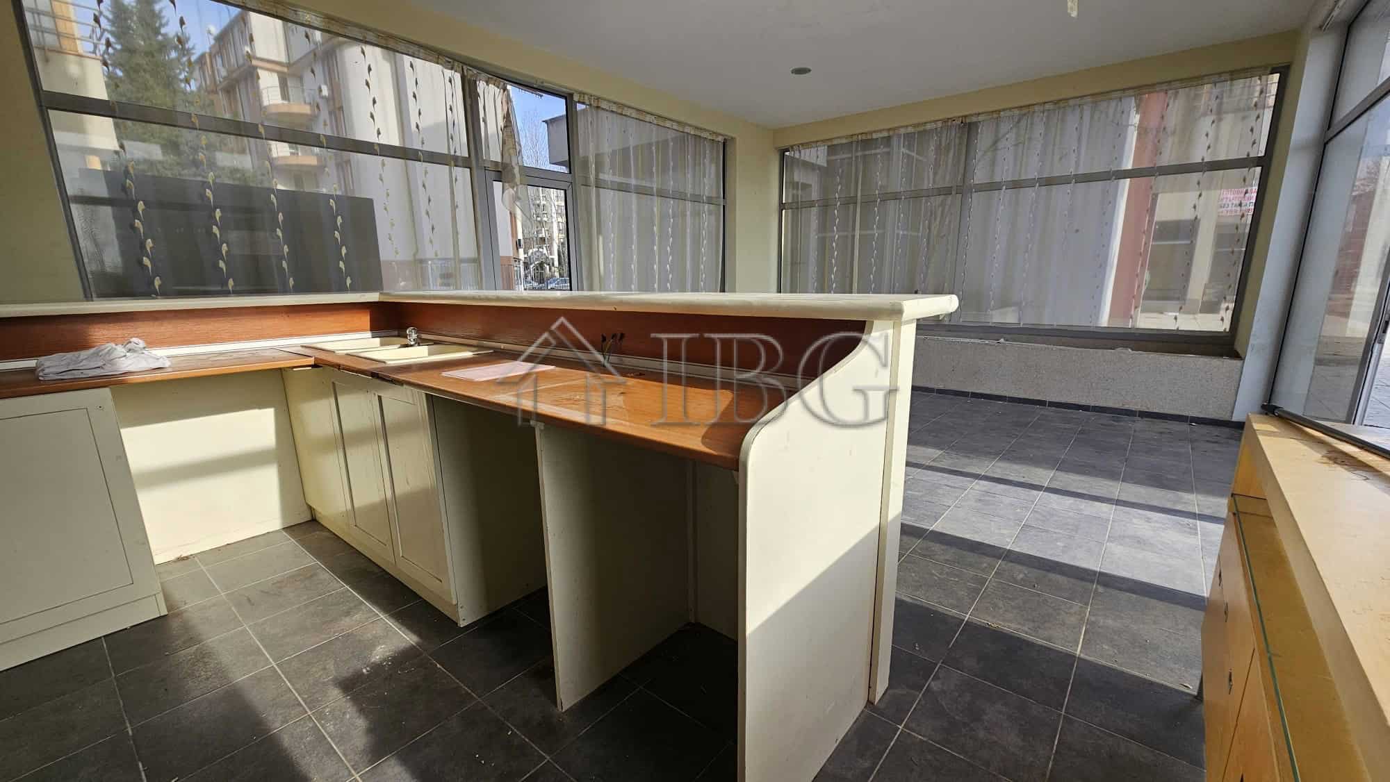Bright commercial space with large windows in Sunny Beach. Ideal location for retail or office use.