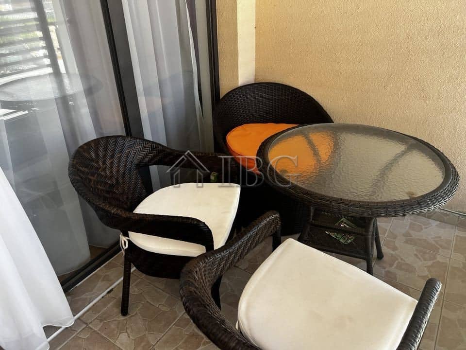 Balcony with outdoor seating and sea view in Sveti Vlas apartment. Perfect for relaxing and enjoying.
