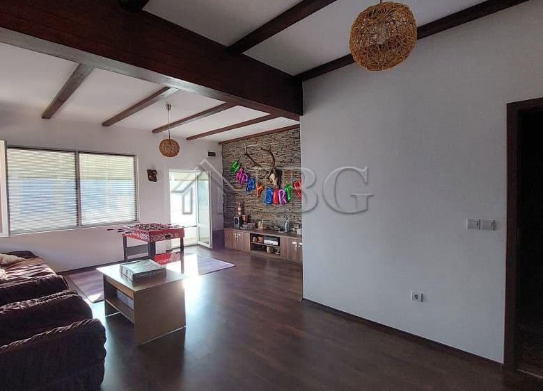 Bright living room with large windows and modern decor in Burgas.
