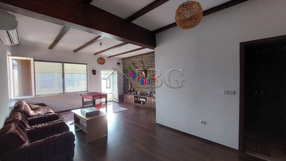 Bright living room with large windows and modern decor in Burgas.