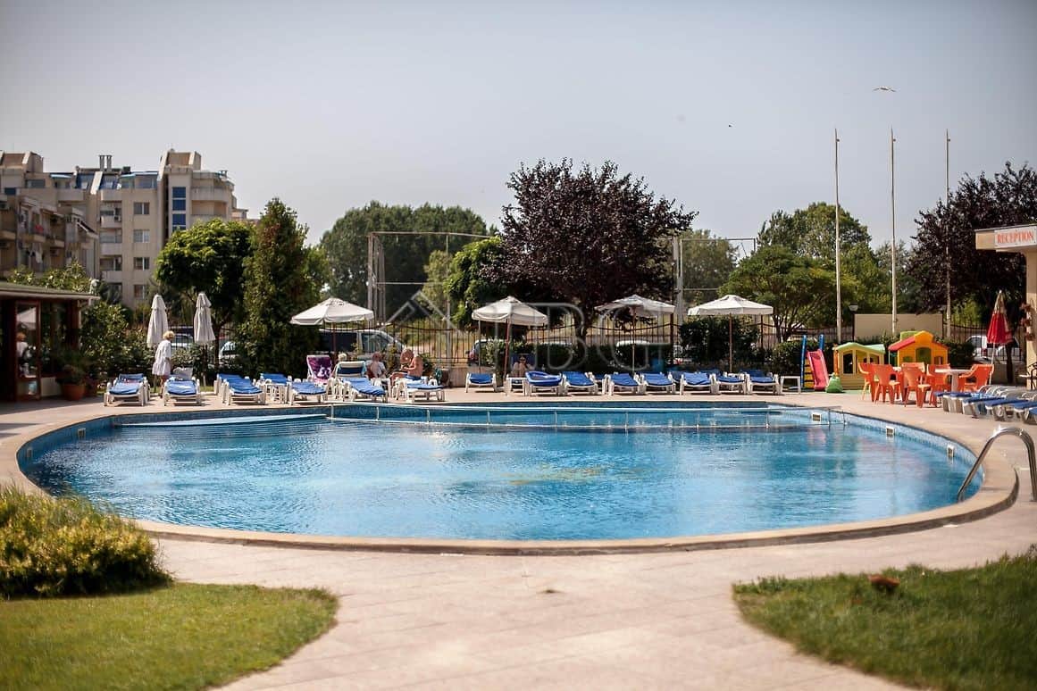 Bright outdoor swimming pool at a sunny holiday apartment complex in Sunny Beach.