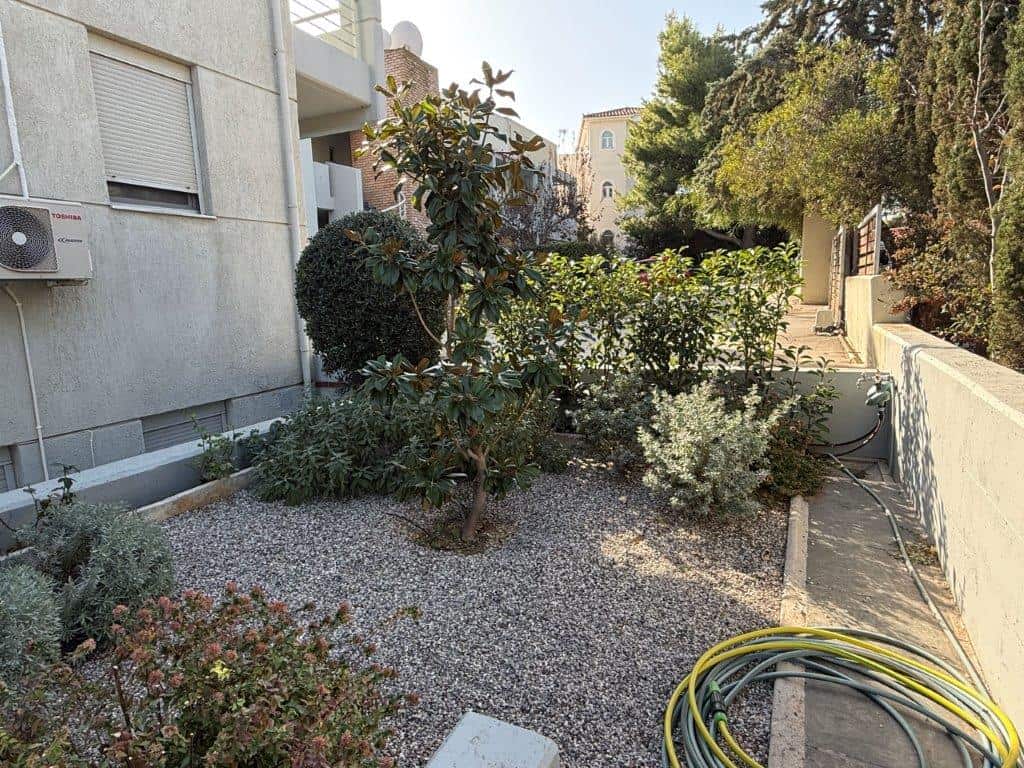 Charming outdoor garden of a luxury 3-bedroom property in Neos Voutzas, Attica, Greece, featuring lu.