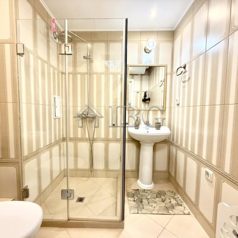 Spacious bathroom with shower in Venera Palace apartment, Sunny Beach.
