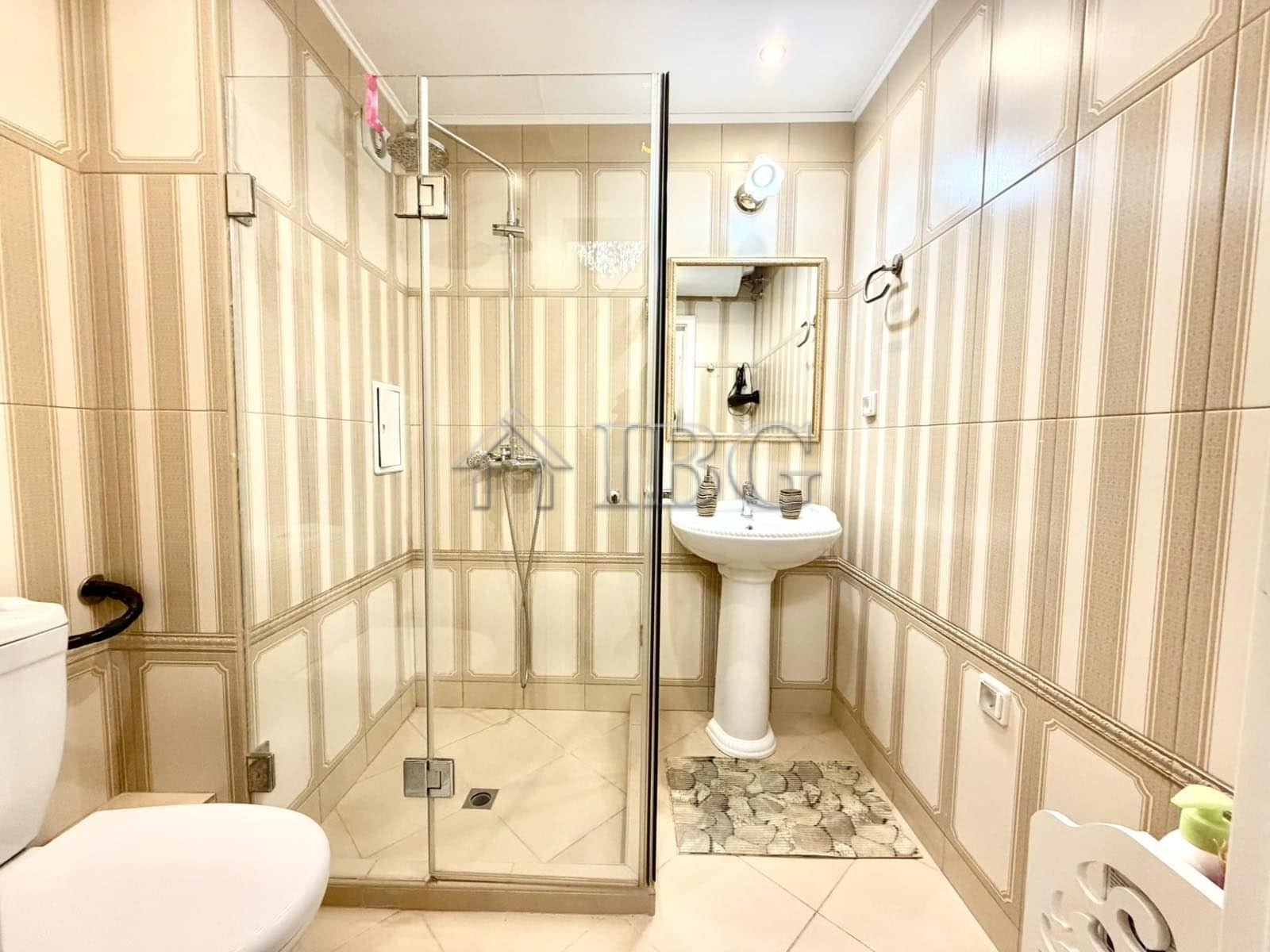 Spacious bathroom with shower in Venera Palace apartment, Sunny Beach.