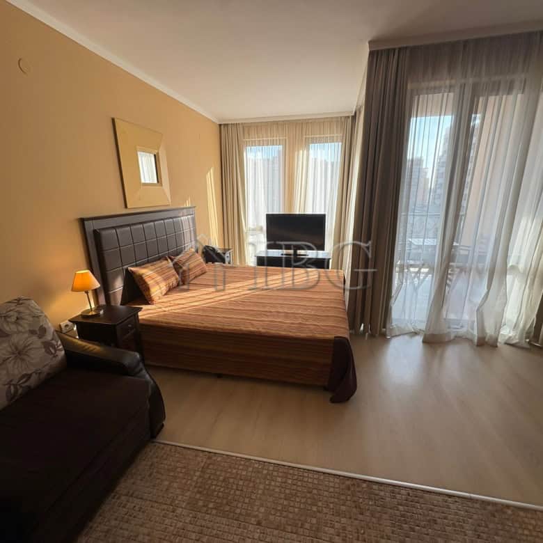Modern studio apartment with pool view and balcony in Sunny Beach.