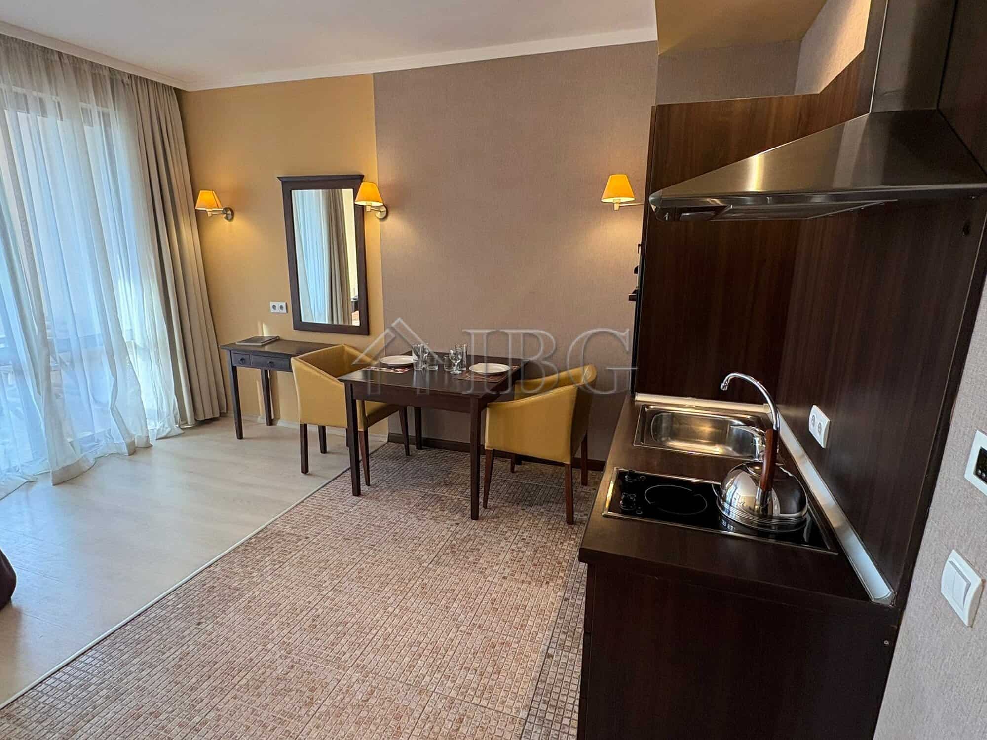 Cozy Studio with Pool View at Royal Beach Barceló Spacious studio apartment featuring a pool view, modern kitchenette, and stylish decor at Royal Beac.