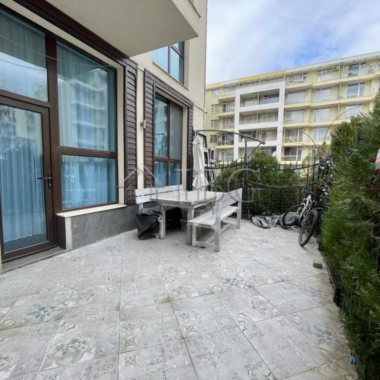 Bright outdoor terrace with seating and bicycles in Sun Gate, Sunny Beach.