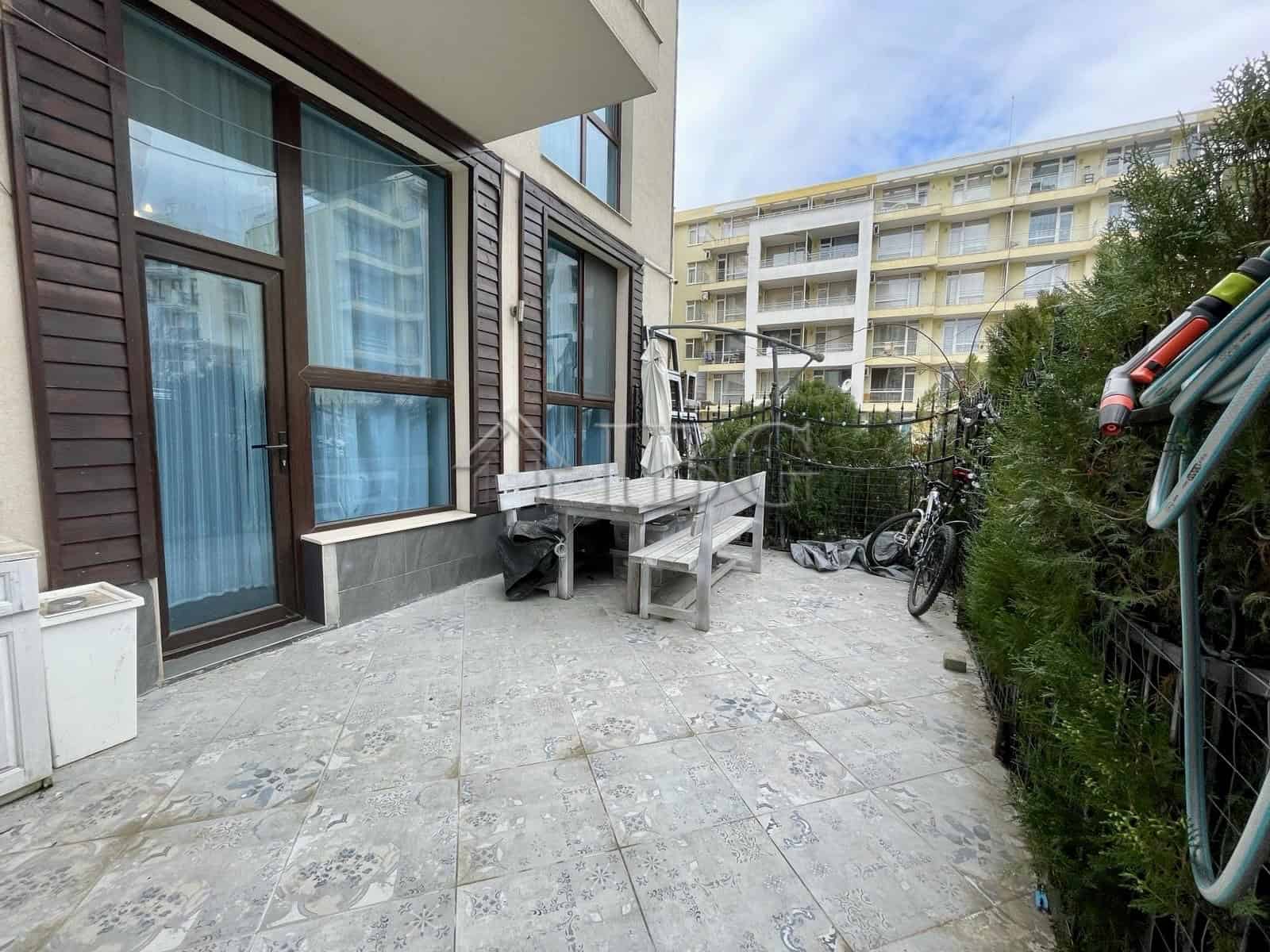 Bright outdoor terrace with seating and bicycles in Sun Gate, Sunny Beach.