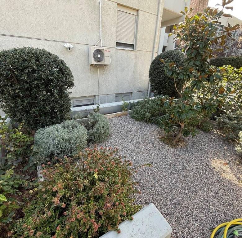Beautiful garden of a luxury 3-bedroom home in Neos Voutzas, Attica, Greece.