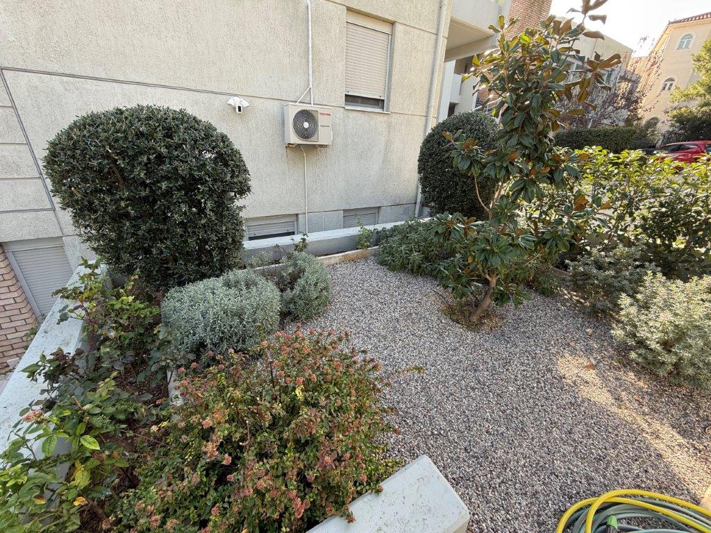 Beautiful garden of a luxury 3-bedroom home in Neos Voutzas, Attica, Greece.