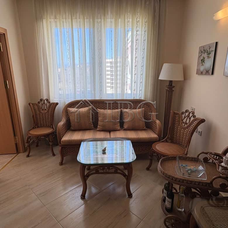 Bright living room with elegant furniture and large window in Majestic Beach Resort, Sunny Beach.
