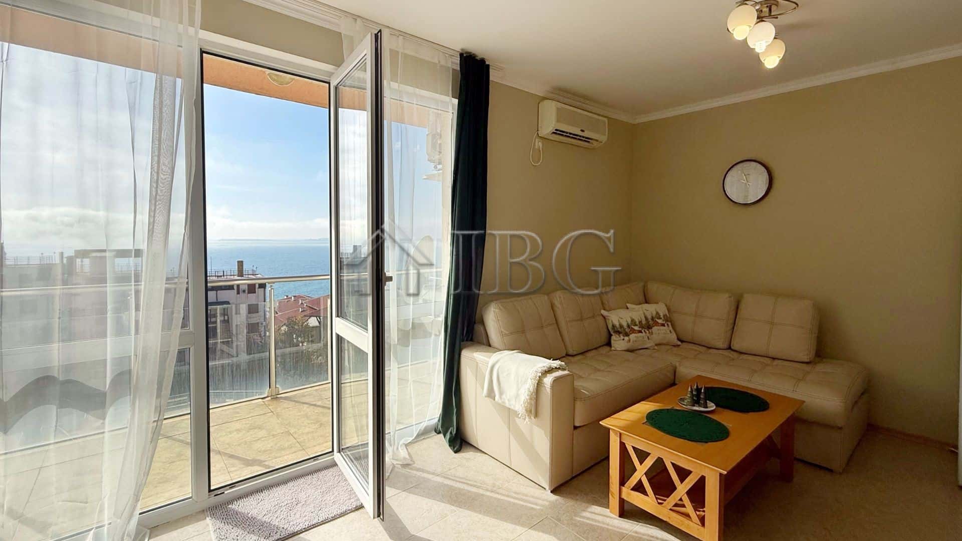 Bright living room with balcony overlooking the sea in Sveti Vlas.